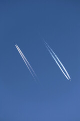 contrail in the sky from two aircraft