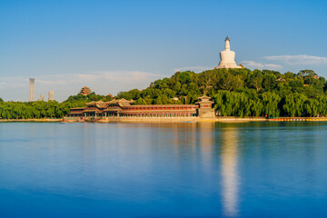 The white pagoda in Beihai Park in Beijing is reflected in the calm water.
