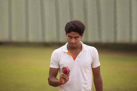 A portrait of a pace bowler preparing to deliver a ball during cricket match