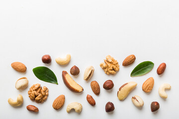Composition of nuts , flat lay - mix hazelnuts, cashews, almonds on table background. healthy eating concepts and food background