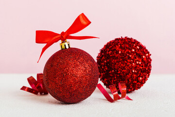 Christmas ball on colored background. decoration bauble with ribbon bow with copy space
