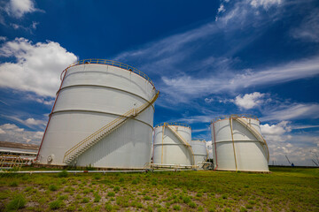 Tank farm in industry Thailand with white oil and petrol silos