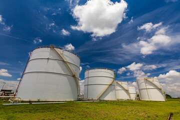 Tank farm in industry Thailand with white oil and petrol silos
