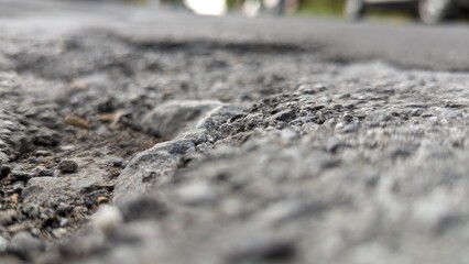 Macro closeup on concrete asphalt cracks on the road