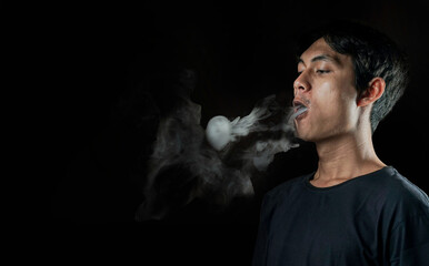 Man making smoke ring with vapor