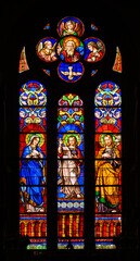Jesus with Mary and Joseph and also with the Holy Trinity. Stained-glass windows in Church of St Alphonsus Liguori, Luxembourg City, Luxembourg. 2022/11/21.