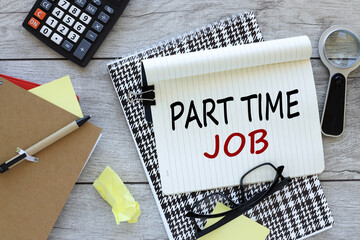 Part time jobs. text on an open notebook. calculator