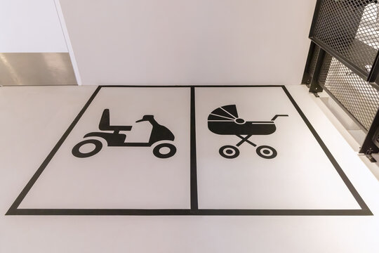 Indoor reserved parking place for mobility scooters and pushchairs