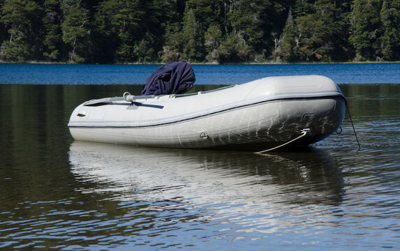 gomon motor boat anchored on the shores of a lake. Fishing boat