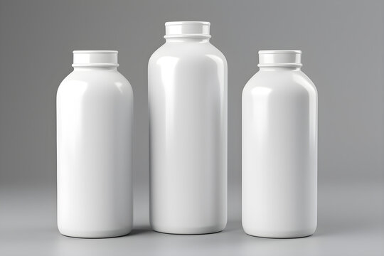Three White Bottles Placed on a Grey Background