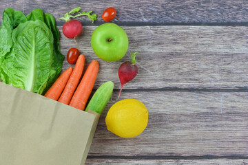 Healthy food background, healthy vegetarian food in paper bags, fruits and vegetables, banner copy space, supermarket shopping, food and clean vegetarian diet concept, organic fruits and vegetables co