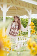 Portrait young woman in a field of sunflowers, Happiness asian woman in a field of sunflowers, Portrait asian woman in a field of sunflowers 