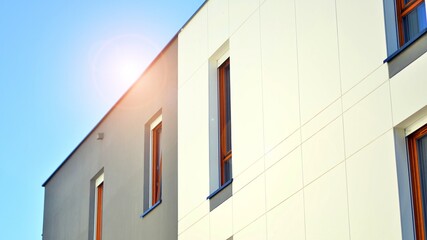 Brand new apartment building on sunny day. Modern residential architecture. Modern multi-family apartment house. 