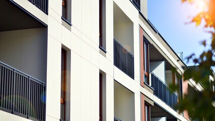 Brand new apartment building on sunny day. Modern residential architecture. Modern multi-family apartment house. 