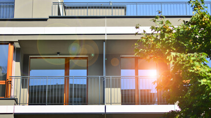 Fototapeta premium Green community. Eco apartment building saving energy and fresh air concept. Block of flats in beautiful green public