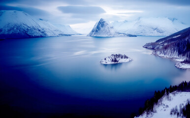 Aerial view of blue sea, snowy mountains, rocks, cloudy sky in winter landscape arctic, seascape 