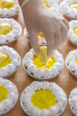 Durian cupcakes and bright yellow durian, Thai cake recipe made from durian, beautifully decorated and ready to eat. Special day celebration ideas.