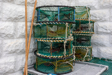 A sea port town piled with fishing nets, fishery-related tools