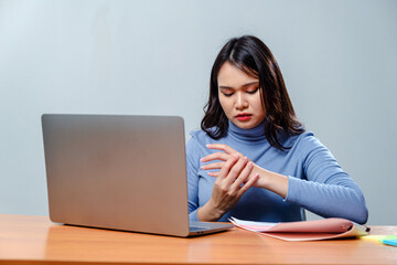 employee woman massage on his hand and arm for relief pain from hard working for stiff or office syndrome concept