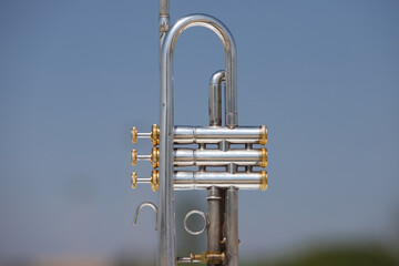 Silver coloured trumpet in the open air. october 1st international day of music.