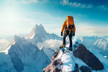 Foto op Canvas A climber climbs a snowy mountain. Bright image, sunset in the mountains. © Uliana
