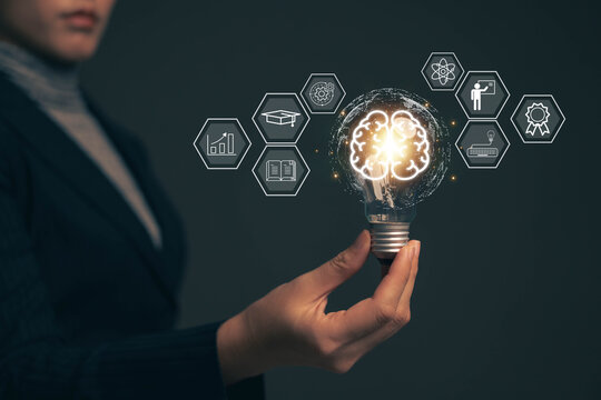 E-learning graduate certificate program concept.Woman holds a light bulb showing a brain icon. Concept of finding educational opportunities. Education Creativity and problem solving