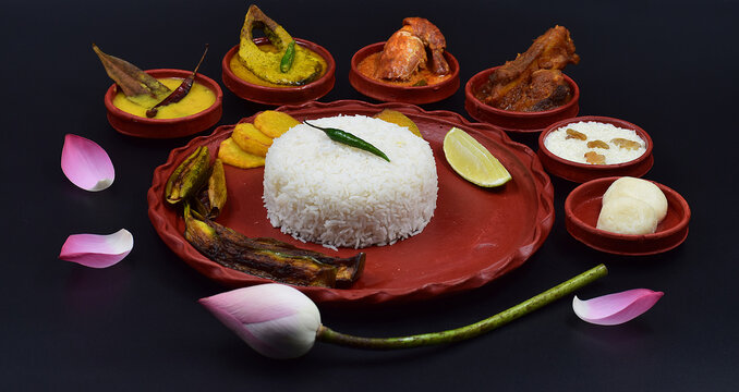DECORATIVE DURGA PUJA BHOG THALI ISOLATED ON BLACK BACKGROUND.