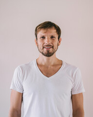Obraz premium Half length portrait of positive guy enjoying free time posing on promotional background near wall,