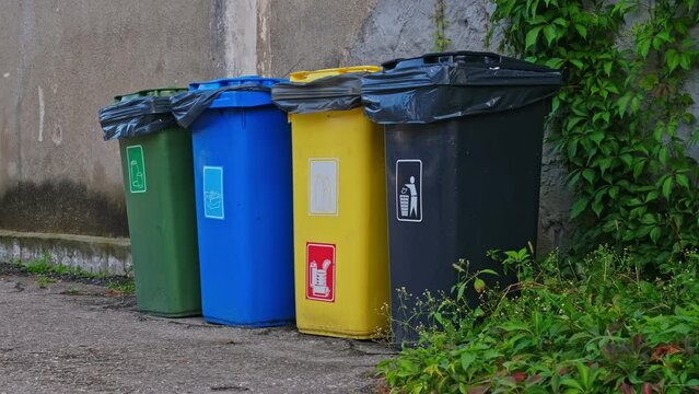 Colorful Dumpster Bins for Various Types of Waste Segregation and Household Recycling Sorting