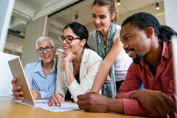 Team of multiethnic creative marketing experts brainstorming during work