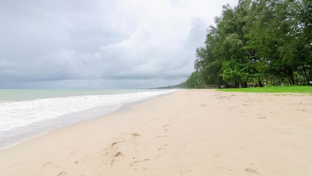 4K Time lapse of tropical sea beach landscape with sunset light of nature cloudscape sky and Clouds moving in raining season time