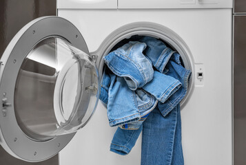 Washing denim items in the washing machine. Delicate cleaning.