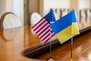 flags of United States and Ukraine. international negotiations. conclusion of contracts between...