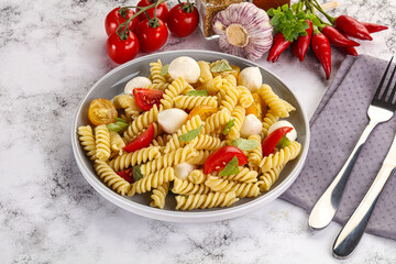 Italian pasta with mozzarella and tomato