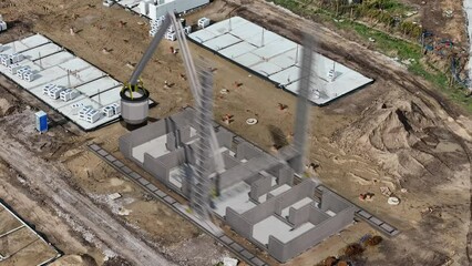 Captured in time-lapse, a large 3D printer steadily layers concrete, forming the walls of a house on a construction site.