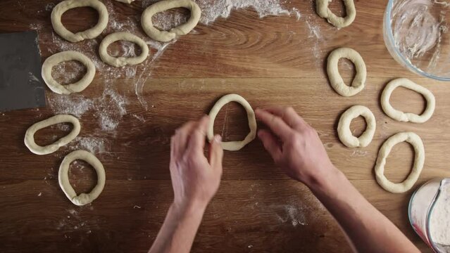 Home baking - making fresh Greek bagels or koulouri of Thessaloniki.
