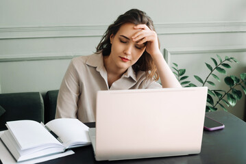 Work-Induced Weariness. Young Woman Suffers from Overwork and Stress. Modern-Day Struggles. Woman Overwhelmed by Overwork and Stress. Young Woman Sleeps at Laptop, Overworked and Stressed.