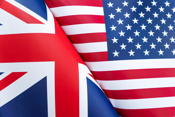 Background of the flags of the USA and Great Britain. The concept of interaction or counteraction between two countries. International relations. political negotiations. Sports competition.