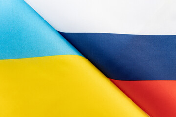 Background of the flags of the ukraine and Russia. concept of interaction or counteraction between the two countries. International relations. political negotiations. Sports competition.