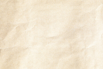 Brown crumpled paper texture with grains macro closeup