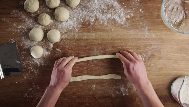 Home baking - making fresh Greek bagels or koulouri of Thessaloniki.