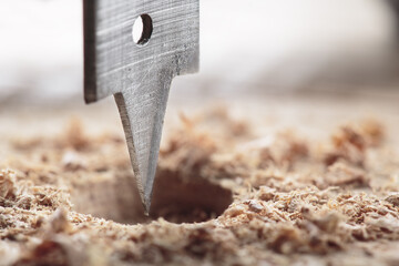 flat or paddle drill bit make holes in wooden oaks plank