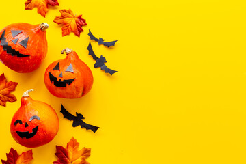 Festive Halloween decoration with pumpkin head and black bats
