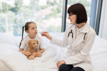 Sick little girl resting on comfy bed while diligent doctor conducting detailed health assessment....