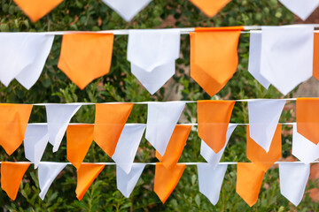 Festive white-orange flags as a background