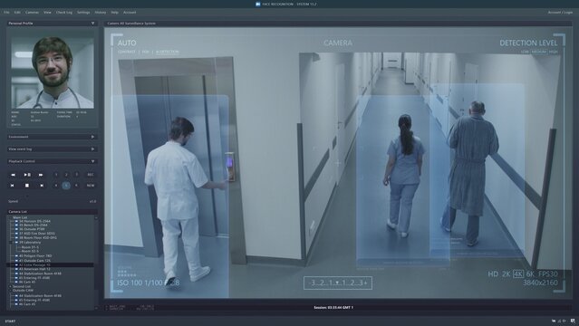 Playback CCTV cameras in modern clinic on PC screen. User interface of surveillance system program and AI face recognition. Security cameras footage. Medical staff and patients in hospital hallway.