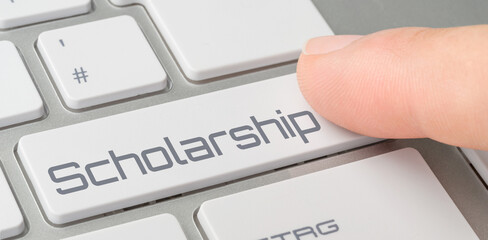 A keyboard with a labeled button - Scholarship