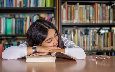 woman reading book in library