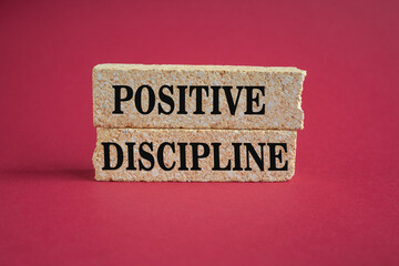 Positive discipline symbol. Concept words Positive discipline on beautiful brick blocks. Beautiful red background. Business psychology positive discipline concept. Copy space