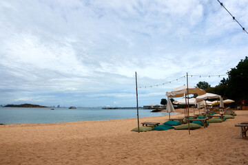 Sea beach landscape with beach umbrellas and beach chairs.